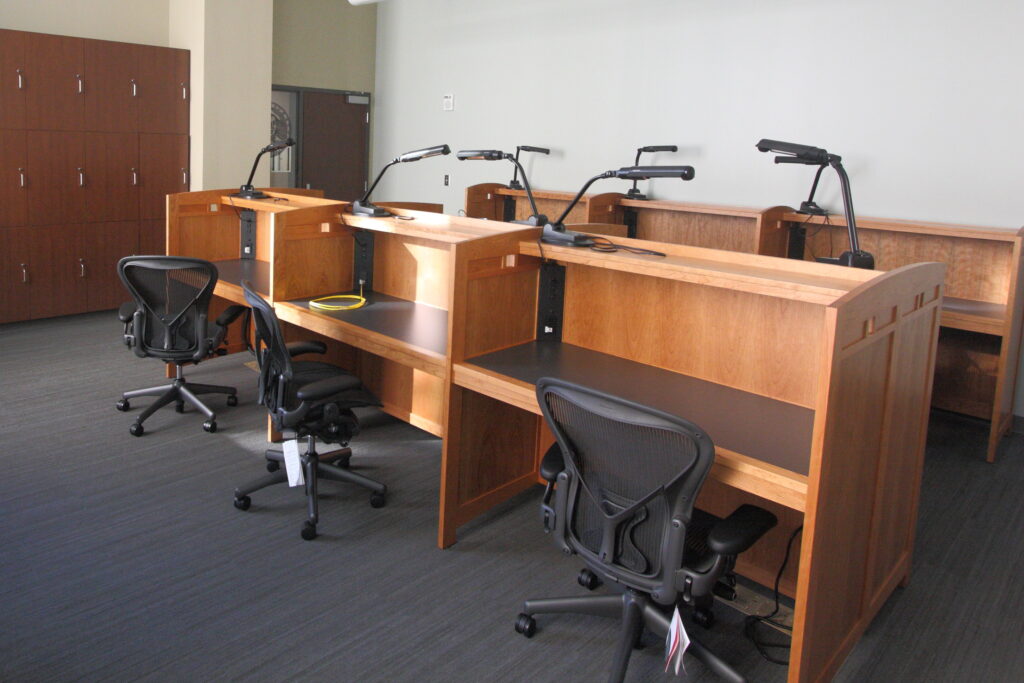 study carrels with desk chairs and lamps